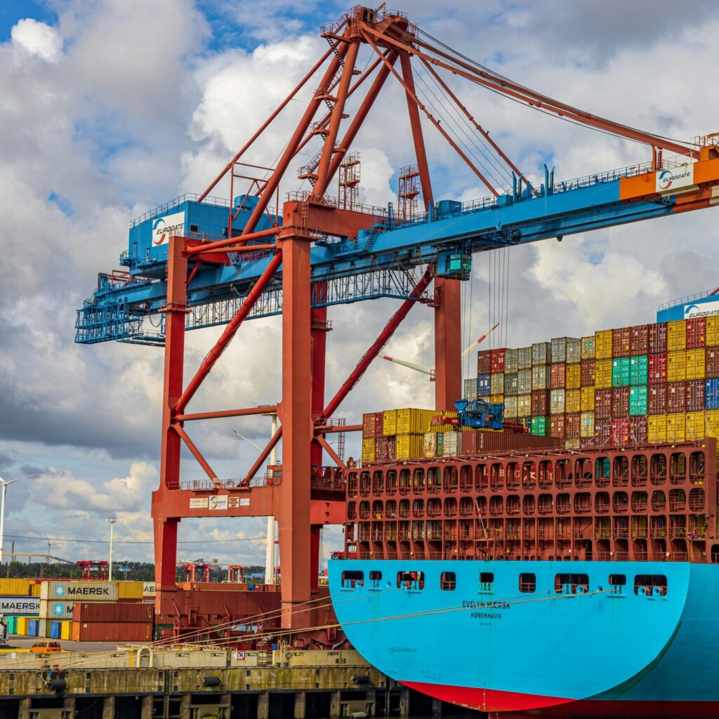 Cargo ship being loaded with containers